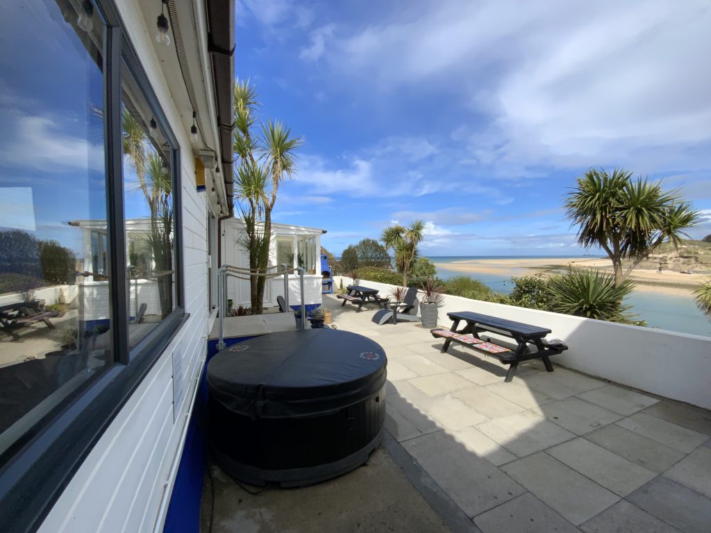 patio with hot tub overlooking the sea